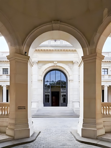 Palais Galliera corridors with arched architecture and columns in Paris.