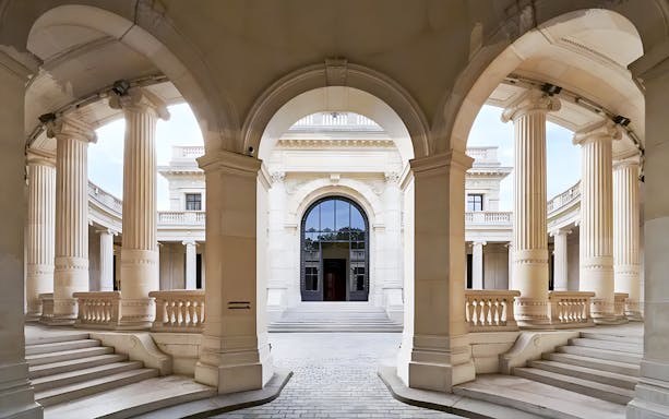Palais Galliera corridors with arched architecture and columns in Paris.