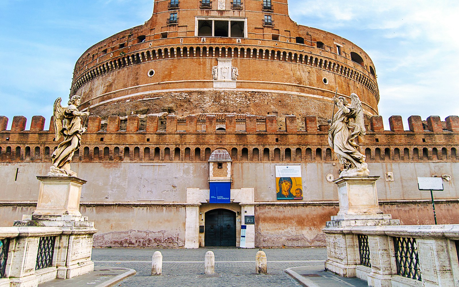 Entrance to Castel Sant'Angelo with angel statues on the bridge, Rome, Italy.