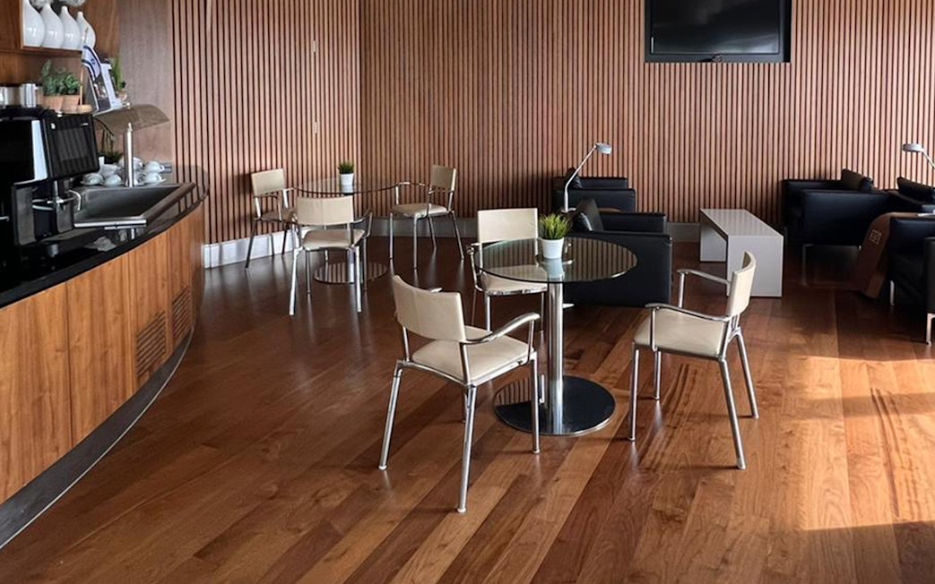 Seating area at Blush Lounge, Terminal 4, London Heathrow Airport with modern decor.