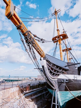 Frigate D. Fernando II e Glória docked with visible masts and rigging, Lisbon, Portugal.