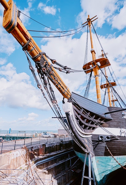 Frigate D. Fernando II e Glória docked with visible masts and rigging, Lisbon, Portugal.