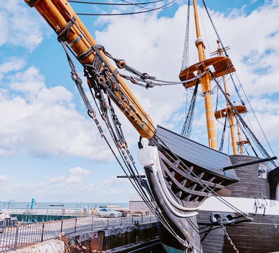 Frigate D. Fernando II e Glória docked with visible masts and rigging, Lisbon, Portugal.