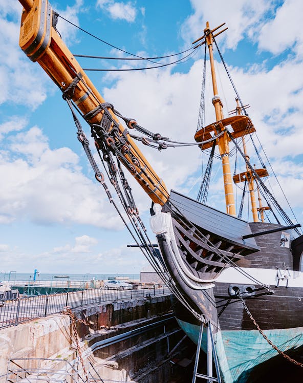 Frigate D. Fernando II e Glória docked with visible masts and rigging, Lisbon, Portugal.
