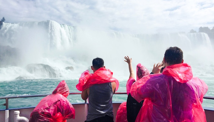 Visitors wearing masks on a river boat ride at Niagara Falls, Canada.