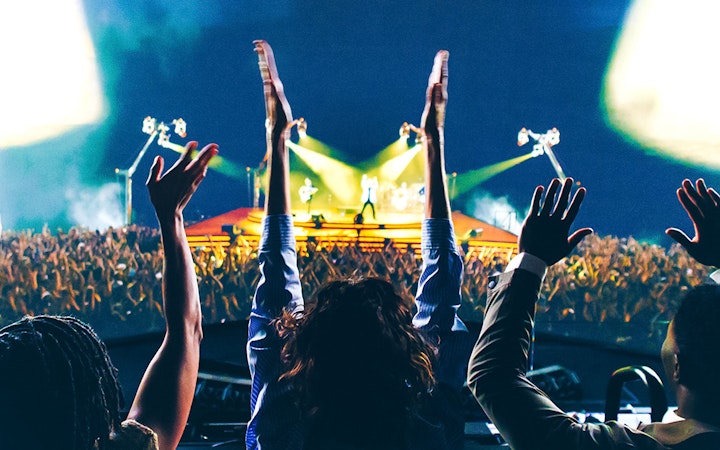 Audience cheering at Sphere Las Vegas during U2 immersive concert film.