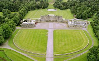 Hopetoun House aerial view, featured in Outlander, surrounded by lush greenery near Edinburgh.