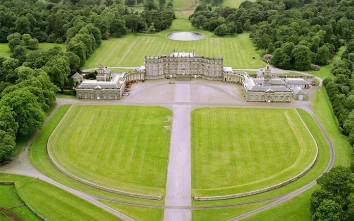 Hopetoun House aerial view, featured in Outlander, surrounded by lush greenery near Edinburgh.