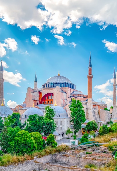 Hagia Sophia with minarets under a blue sky in Eminonu, Istanbul, Turkey.