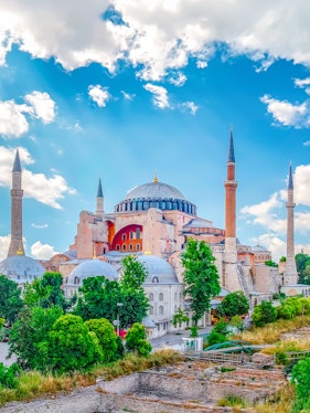 Hagia Sophia with minarets under a blue sky in Eminonu, Istanbul, Turkey.