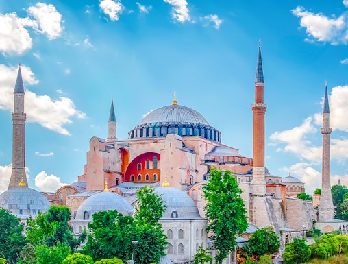 Hagia Sophia with minarets under a blue sky in Eminonu, Istanbul, Turkey.