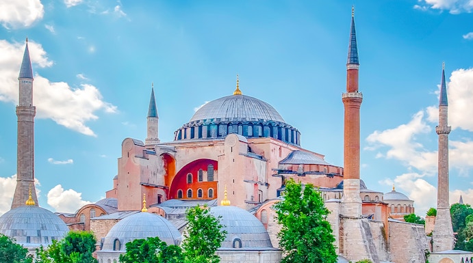 Hagia Sophia with minarets under a blue sky in Eminonu, Istanbul, Turkey.