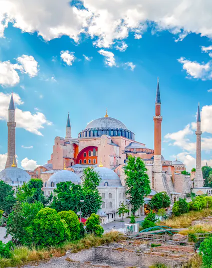 Hagia Sophia with minarets under a blue sky in Eminonu, Istanbul, Turkey.