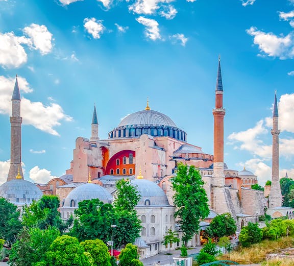 Hagia Sophia with minarets under a blue sky in Eminonu, Istanbul, Turkey.
