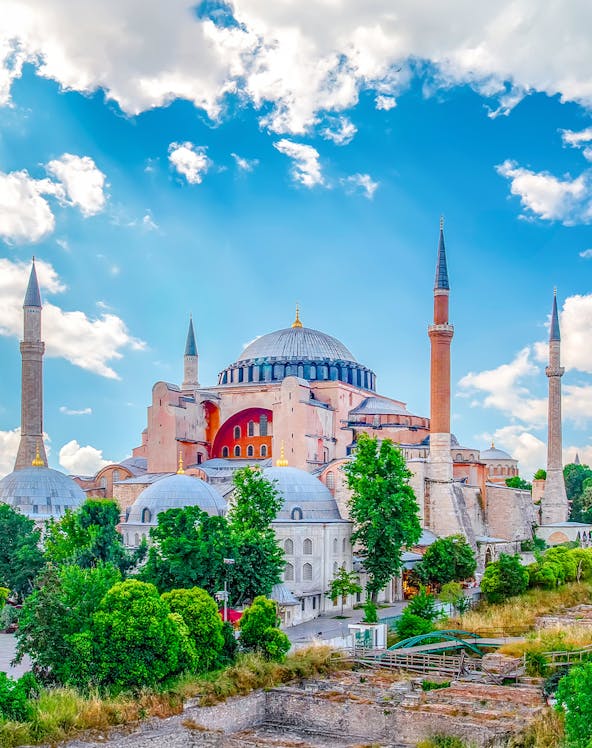 Hagia Sophia with minarets under a blue sky in Eminonu, Istanbul, Turkey.
