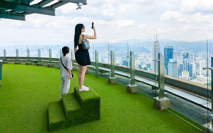 Visitors enjoying the view from Kuala Lumpur Tower Sky Terrace.