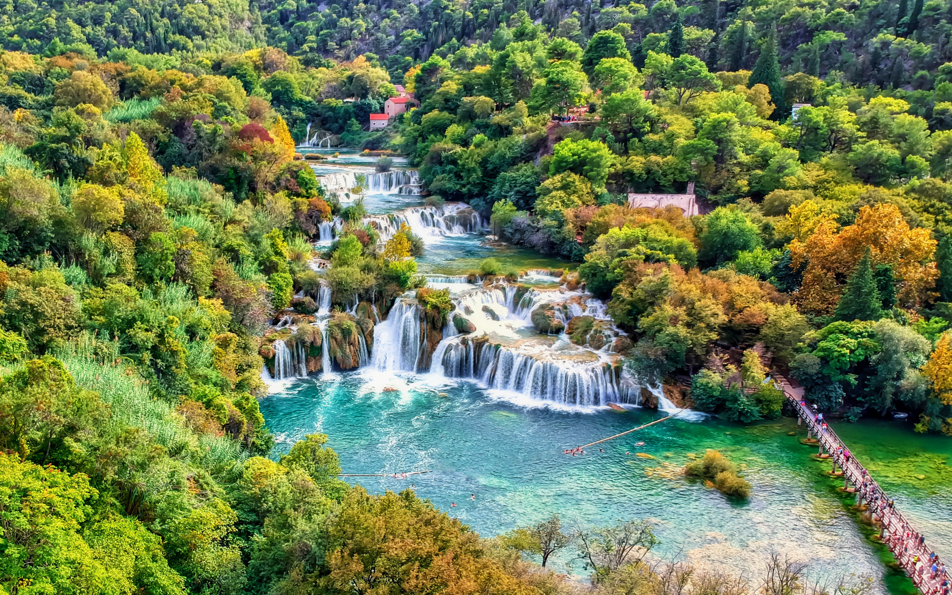 Aerial view of Krka waterfalls surrounded by autumn foliage in Krka National Park, Croatia.