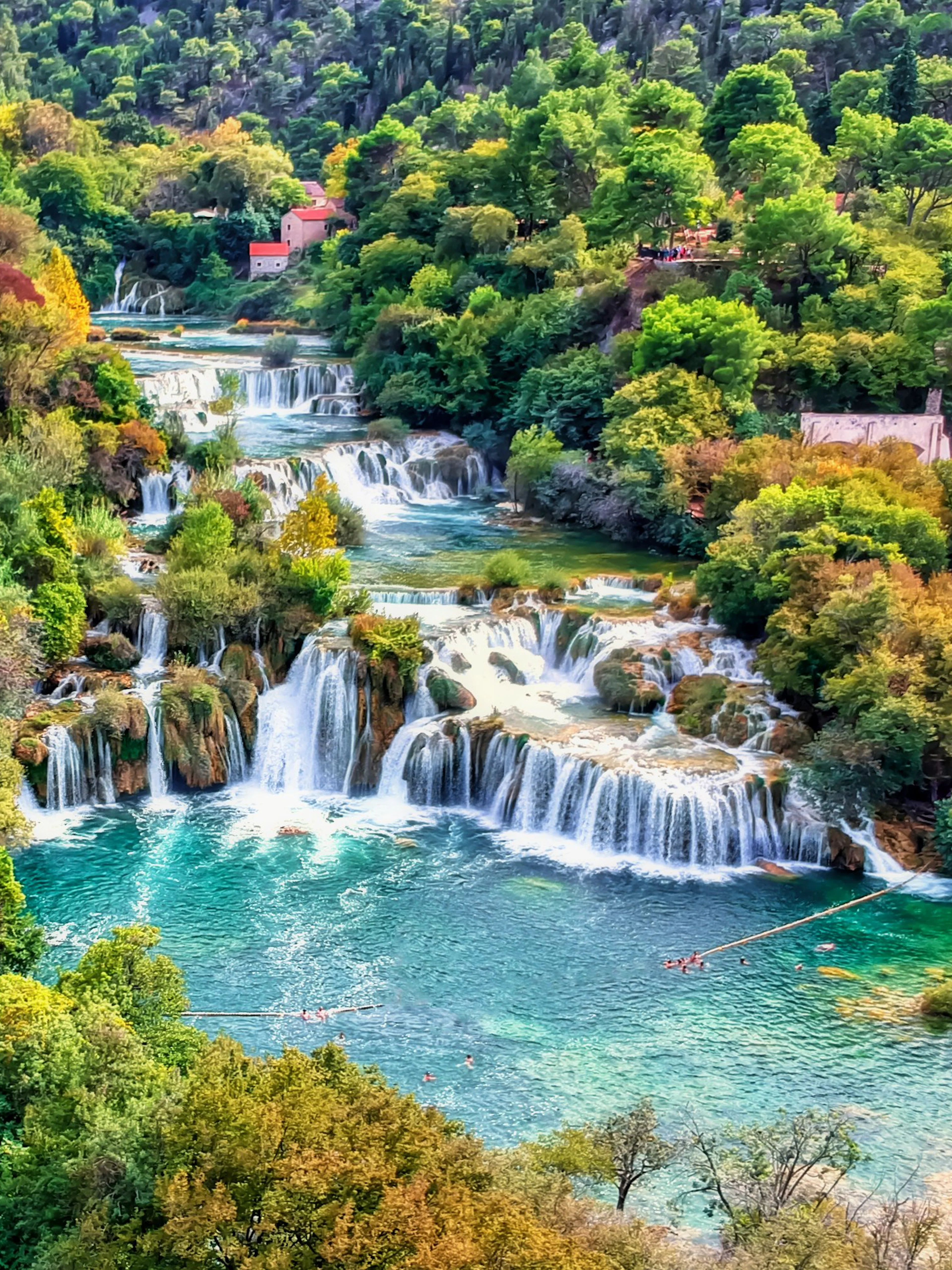 Aerial view of Krka waterfalls surrounded by autumn foliage in Krka National Park, Croatia.
