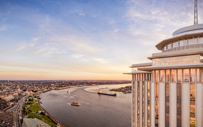 Aerial view of the Vue Orleans Observation Deck overlooking the Mississippi River at sunset.