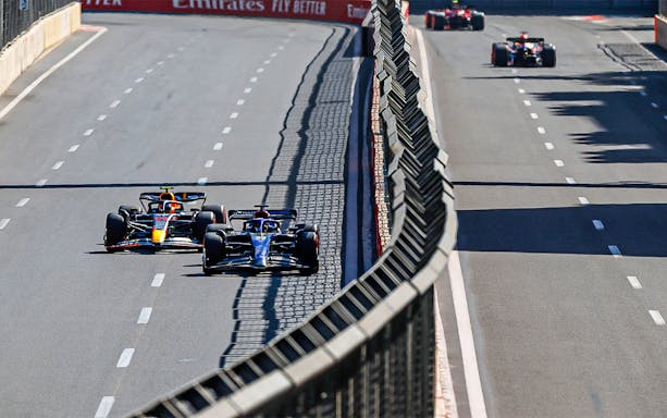 Formula 1 cars racing on the Baku City Circuit during the Azerbaijan Grand Prix.