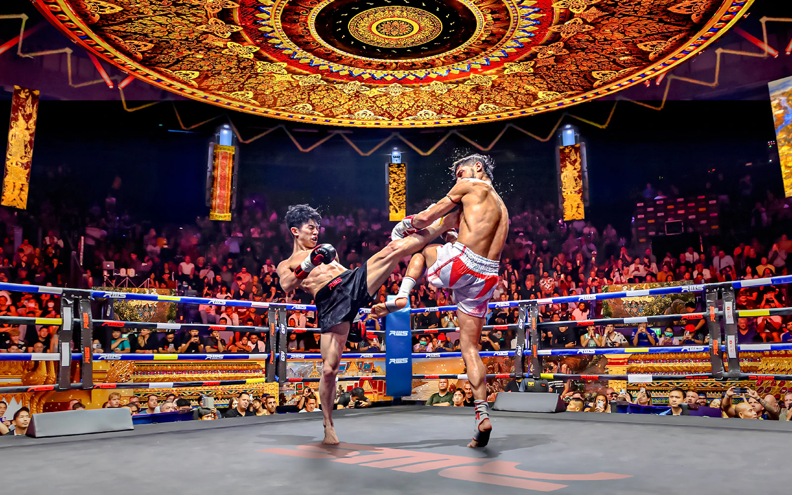 Muay Thai fighters in action at Rajadamnern Boxing Stadium, Bangkok.
