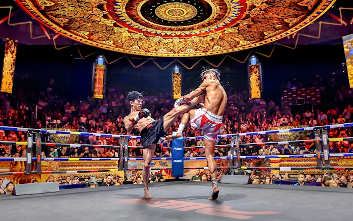 Muay Thai fighters in action at Rajadamnern Boxing Stadium, Bangkok.