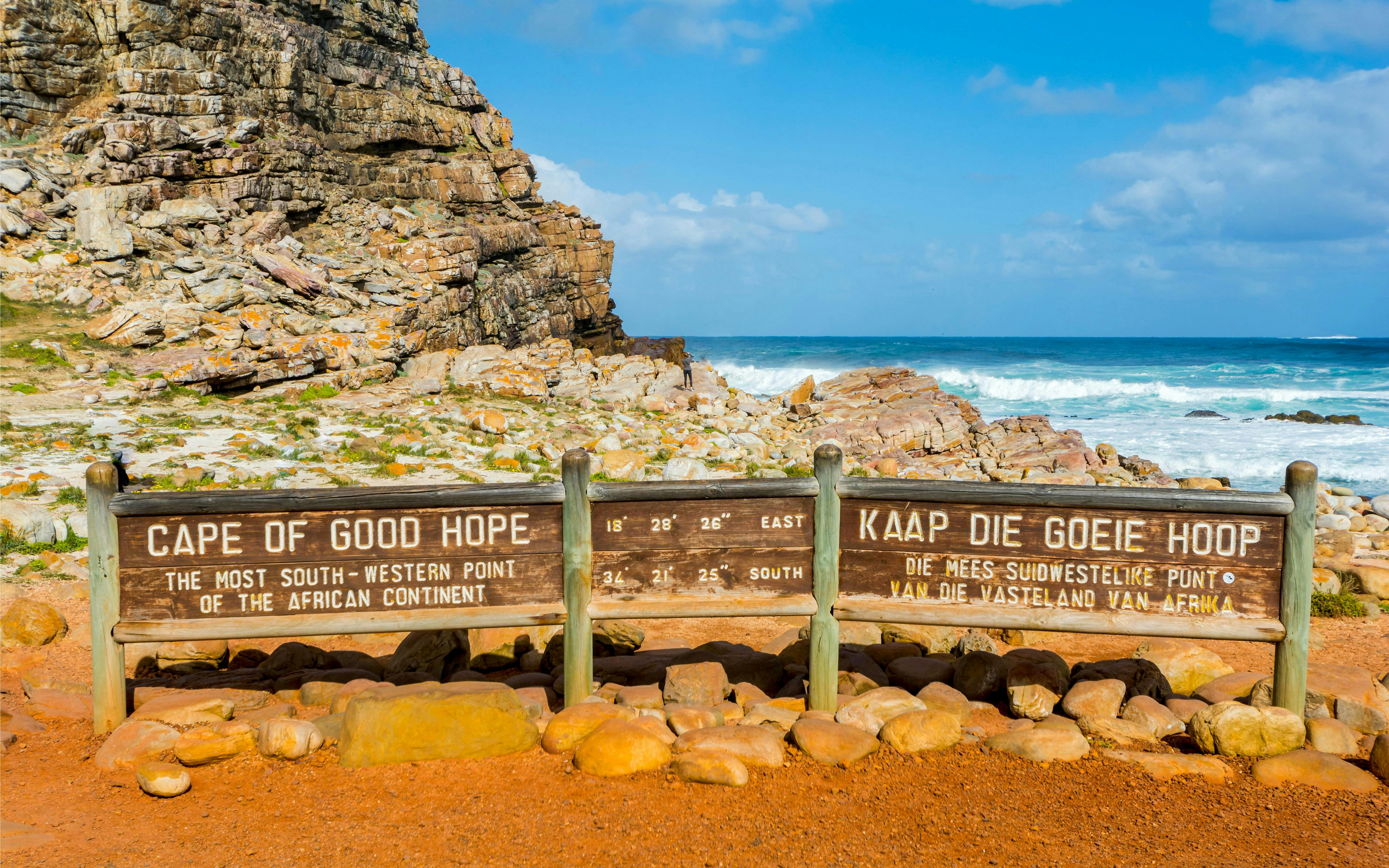 Cape of Good Hope sign with ocean and rocky landscape, Cape Town, South Africa.