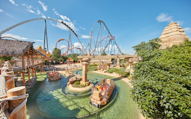 River ride and roller coasters at PortAventura Park, Spain.