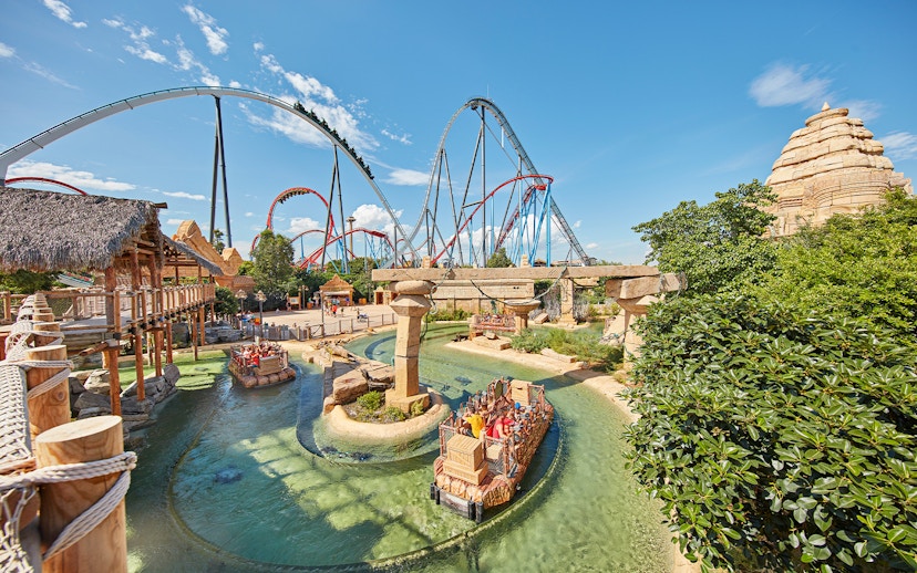 River ride and roller coasters at PortAventura Park, Spain.