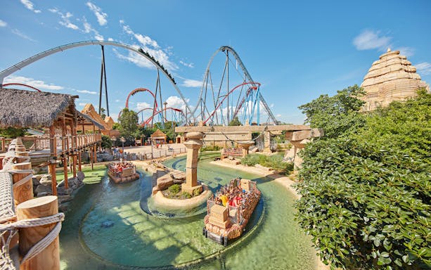 River ride and roller coasters at PortAventura Park, Spain.