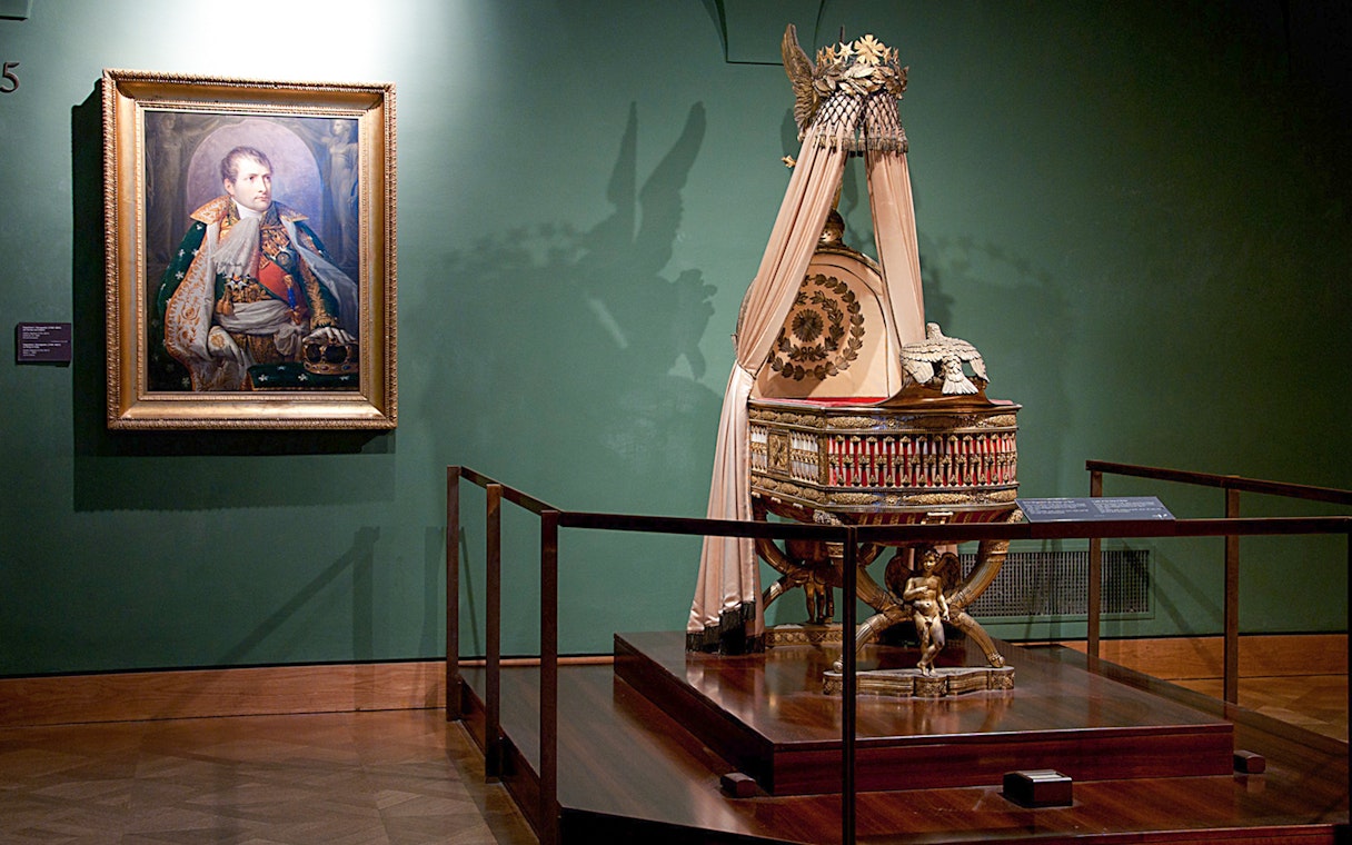 Portrait and imperial cradle display at Imperial Treasury Vienna.
