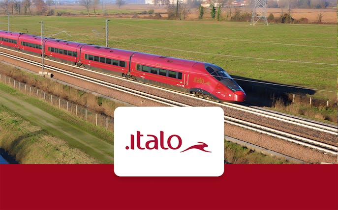 High-speed Italo train traveling through countryside between Milan and Venice.