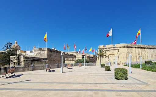Historic fort with flags in the 3 Cities Tour, Malta.