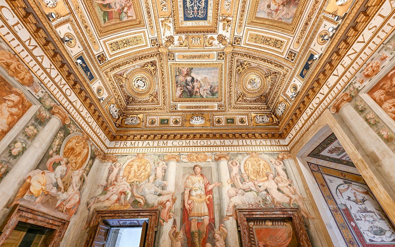 Interior of Castel Sant'Angelo featuring ornate ceiling details and frescoes in Rome, Italy.