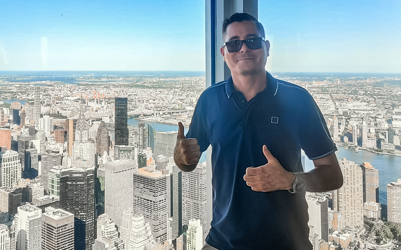 tourist enjoying view from 102nd floor of empire state building