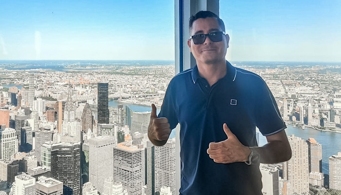 tourist enjoying view from 102nd floor of empire state building