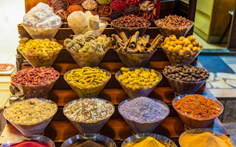 Spices displayed in bowls at a market in Dubai during a half-day sightseeing tour.