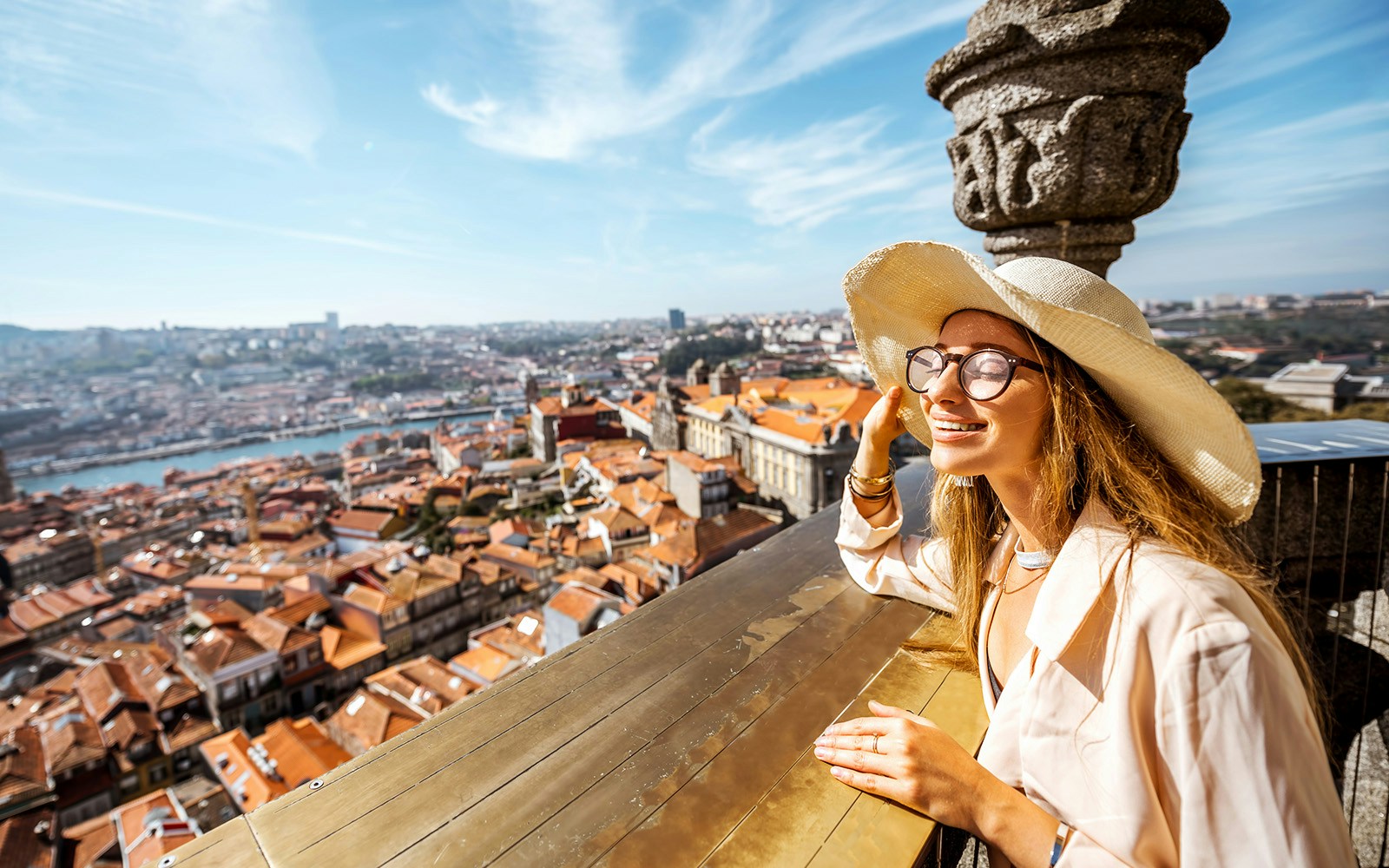Visitor enjoying the view from Clerigos Tower in Porto, Portugal.