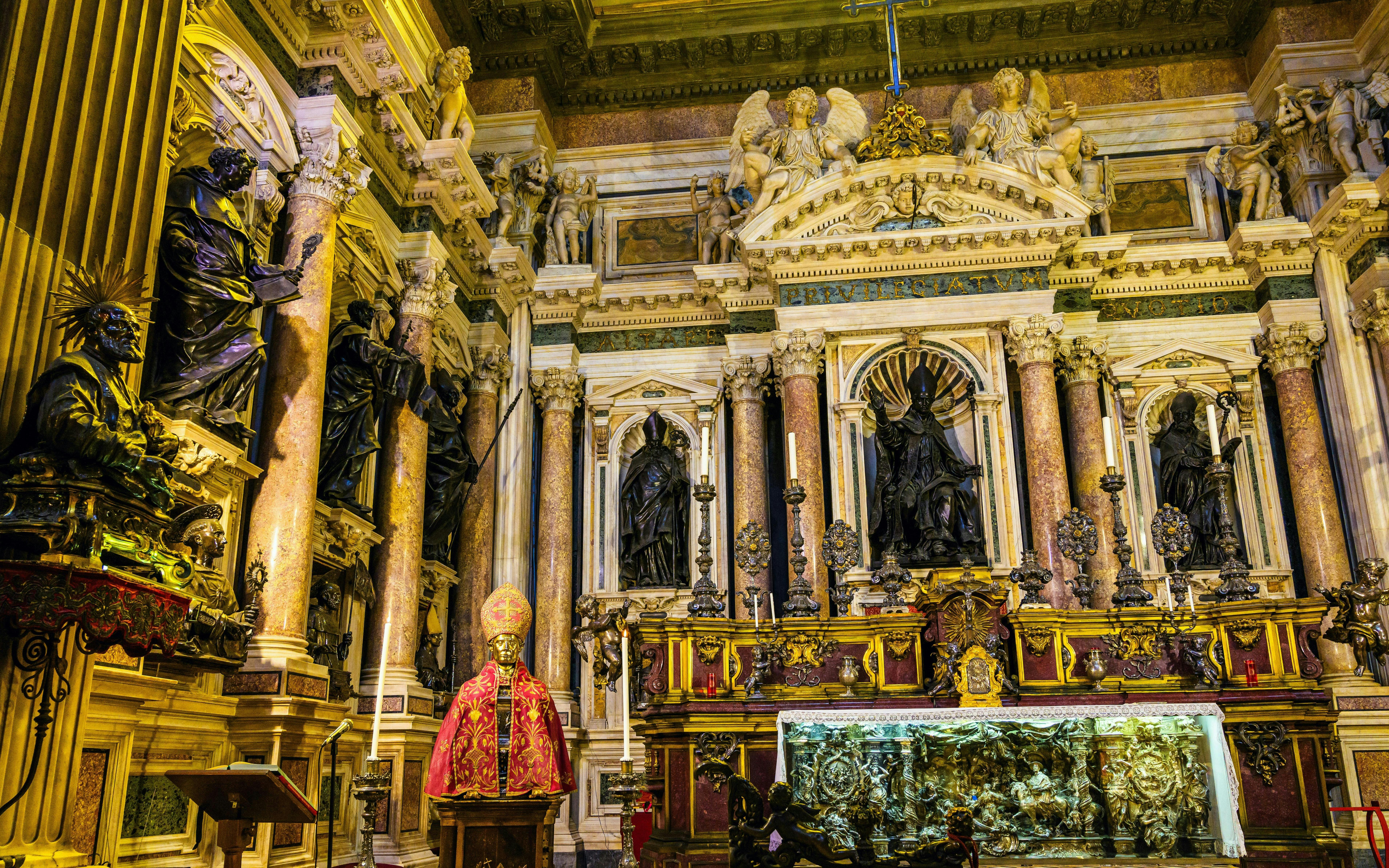 Royal Chapel of the Treasure of San Gennaro interior with ornate statues and altar.