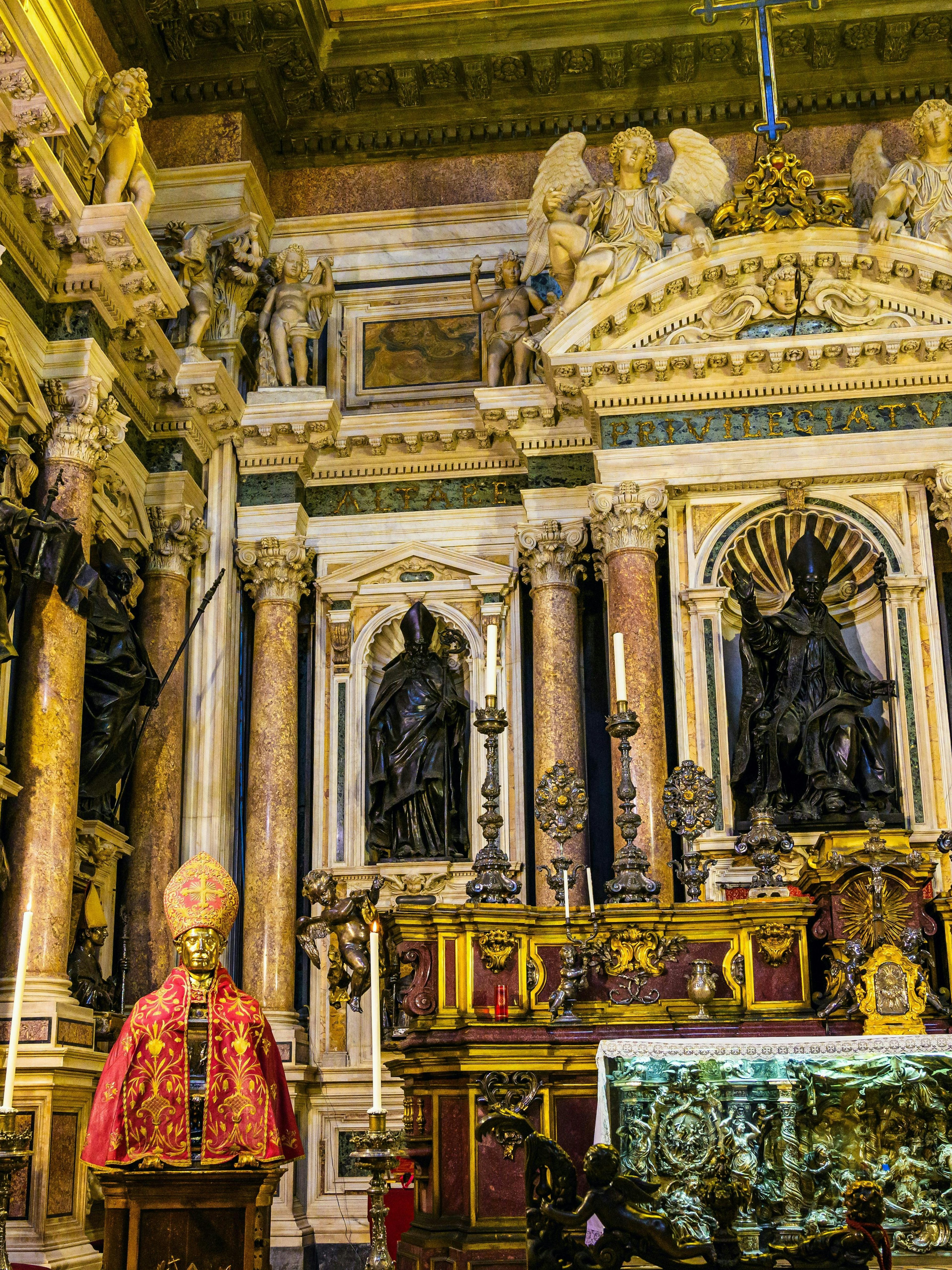 Royal Chapel of the Treasure of San Gennaro interior with ornate statues and altar.