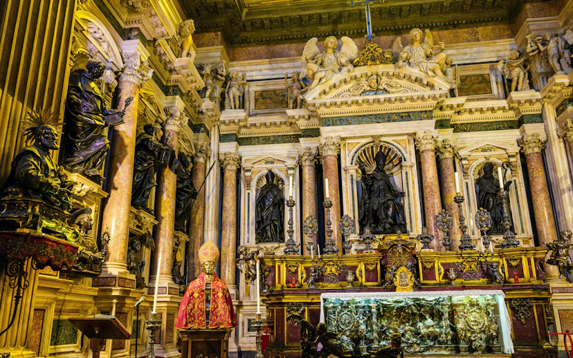 Royal Chapel of the Treasure of San Gennaro interior with ornate statues and altar.
