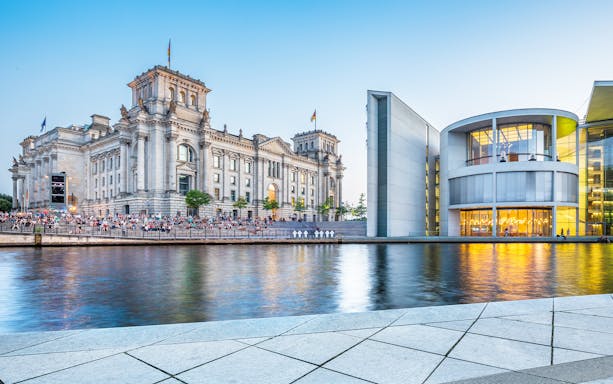 Reichstag building and modern architecture in Berlin's Parliament District, Germany.
