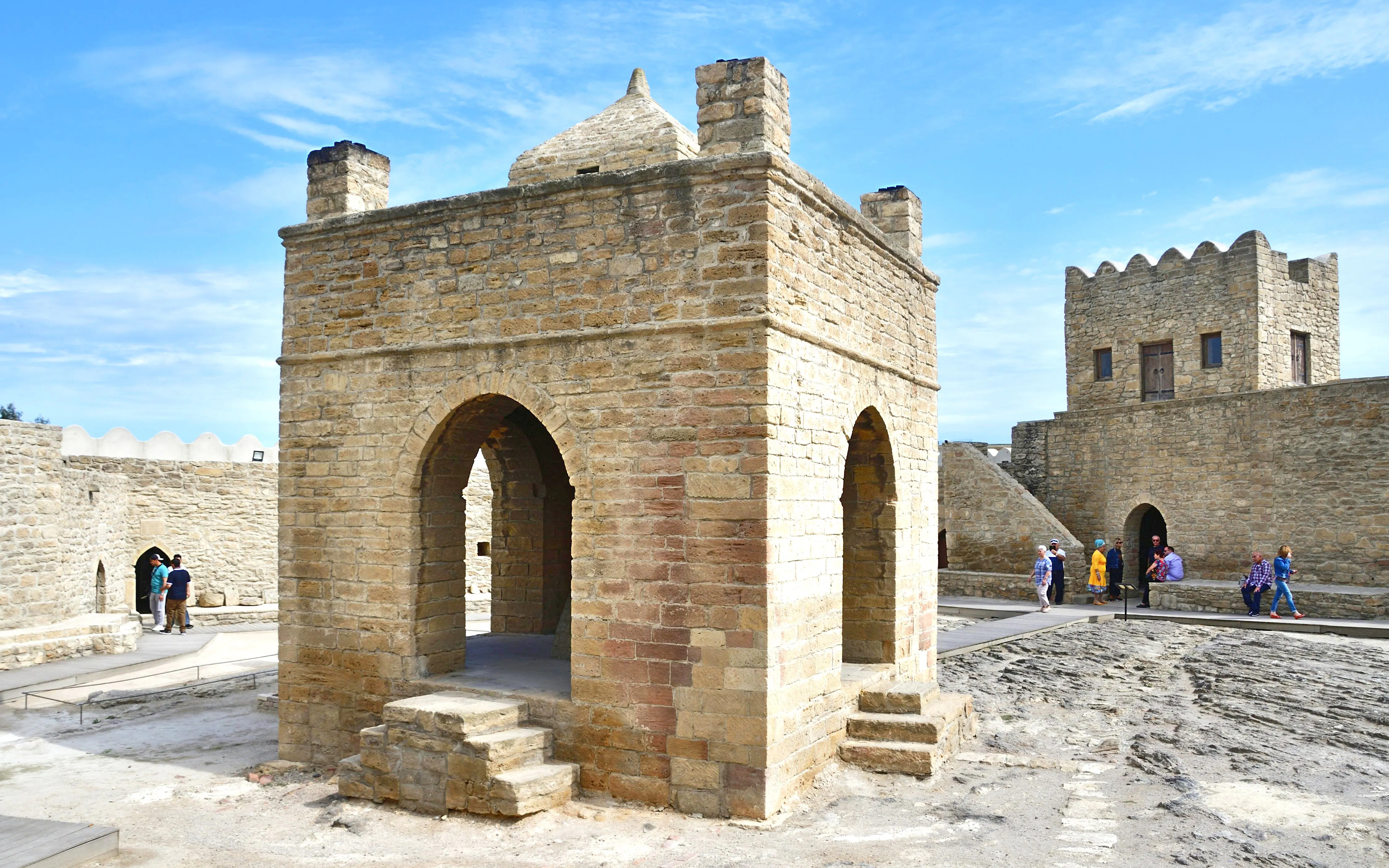 Ateshgah Fire Temple in Baku, Azerbaijan, with visitors exploring the historic site.