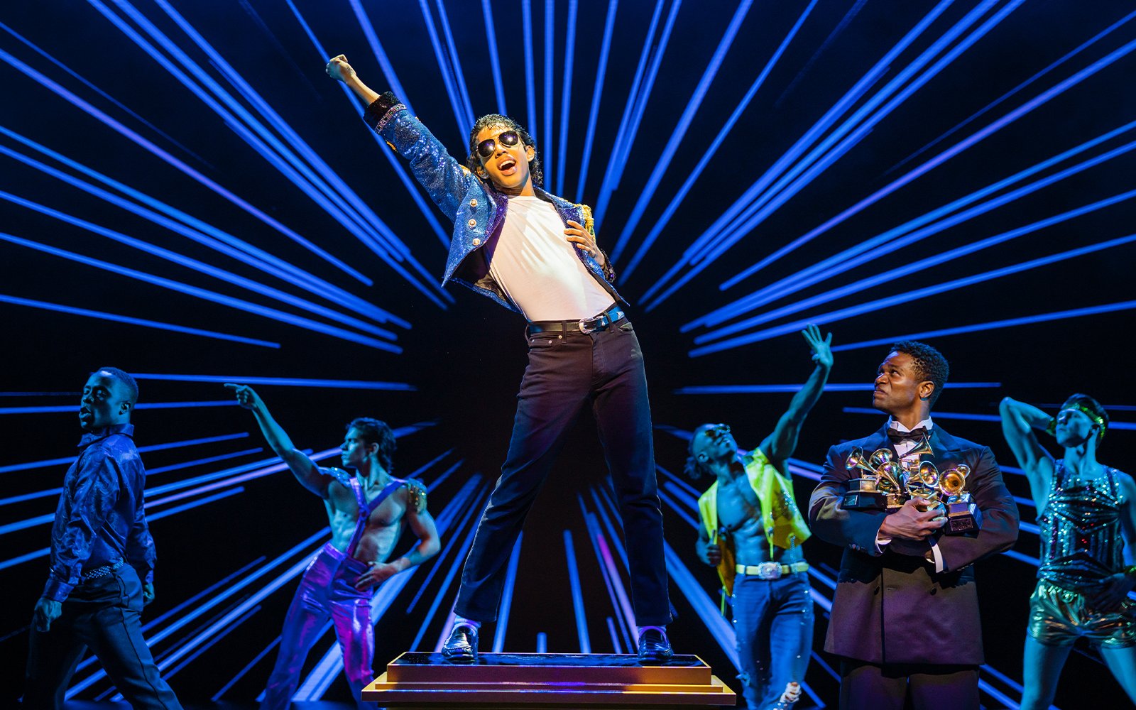 Stage performance of MJ the Musical in Brisbane with dancers and vibrant lighting.