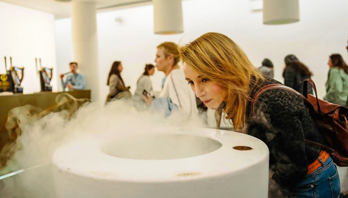 Visitors exploring interactive exhibits at Guinness Storehouse, Dublin, Ireland.