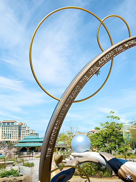 Goddess Luna statue with celestial arch at Epic Universe, Universal Orlando, Florida.