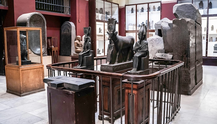 Ancient Egyptian statues and artefacts displayed in the Grand Egyptian Museum.