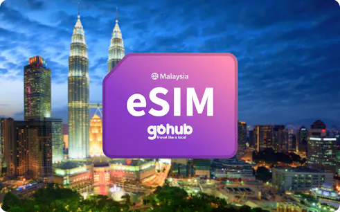 Kuala Lumpur skyline with Petronas Towers and eSIM promotion.