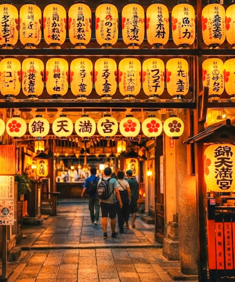 Nishiki Tenmangu Shrine entrance with lanterns, Kyoto, Japan.