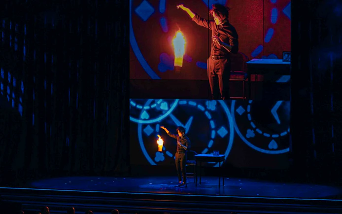 Magician performing with fire on stage at Shim Lim show, Las Vegas.